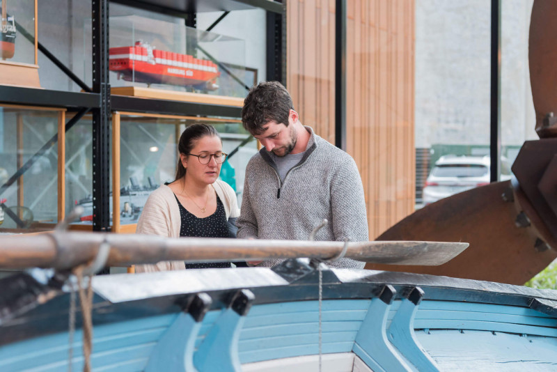 people looking at boat